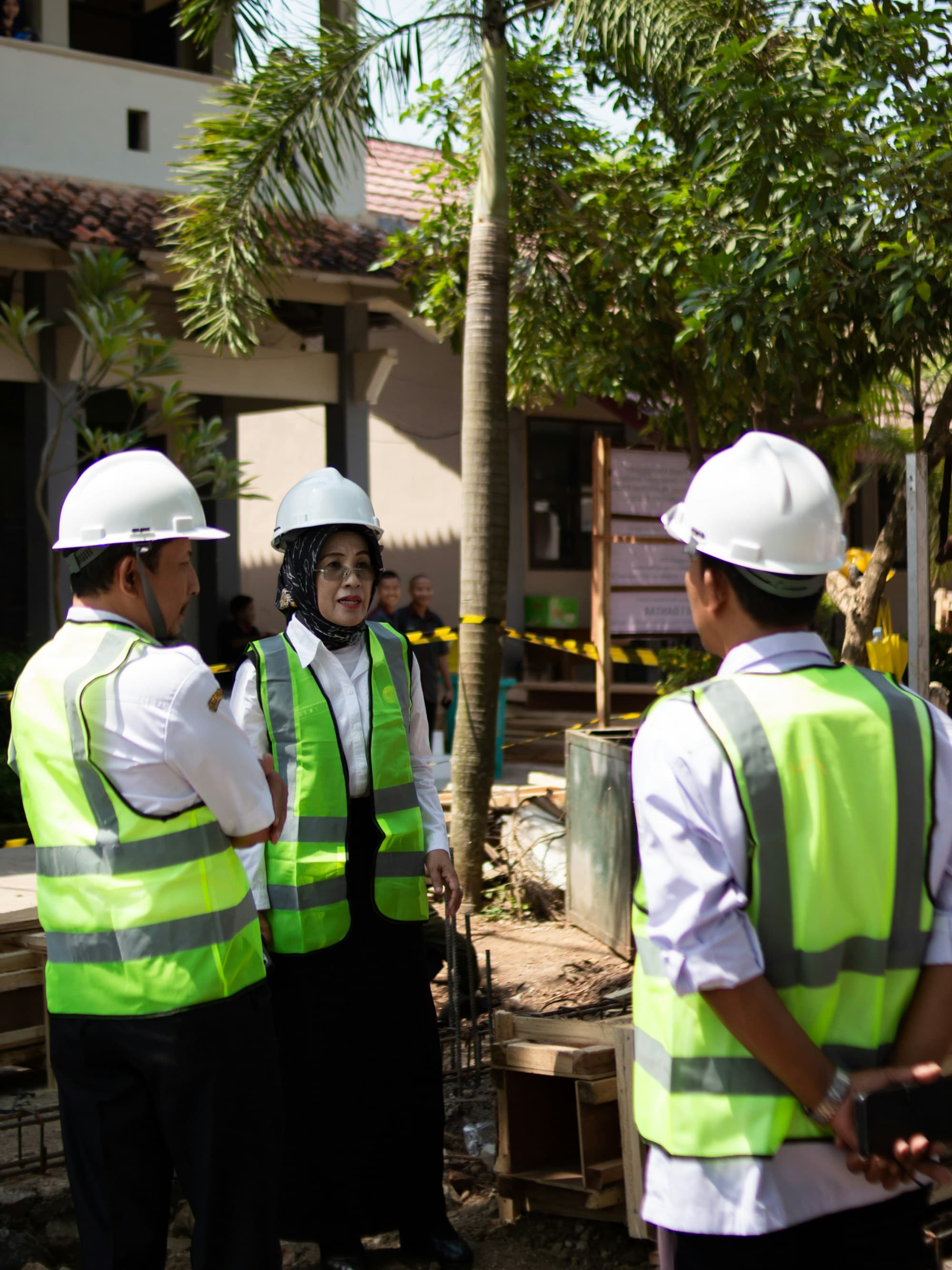 Site leadership discussing a project on an active construction site