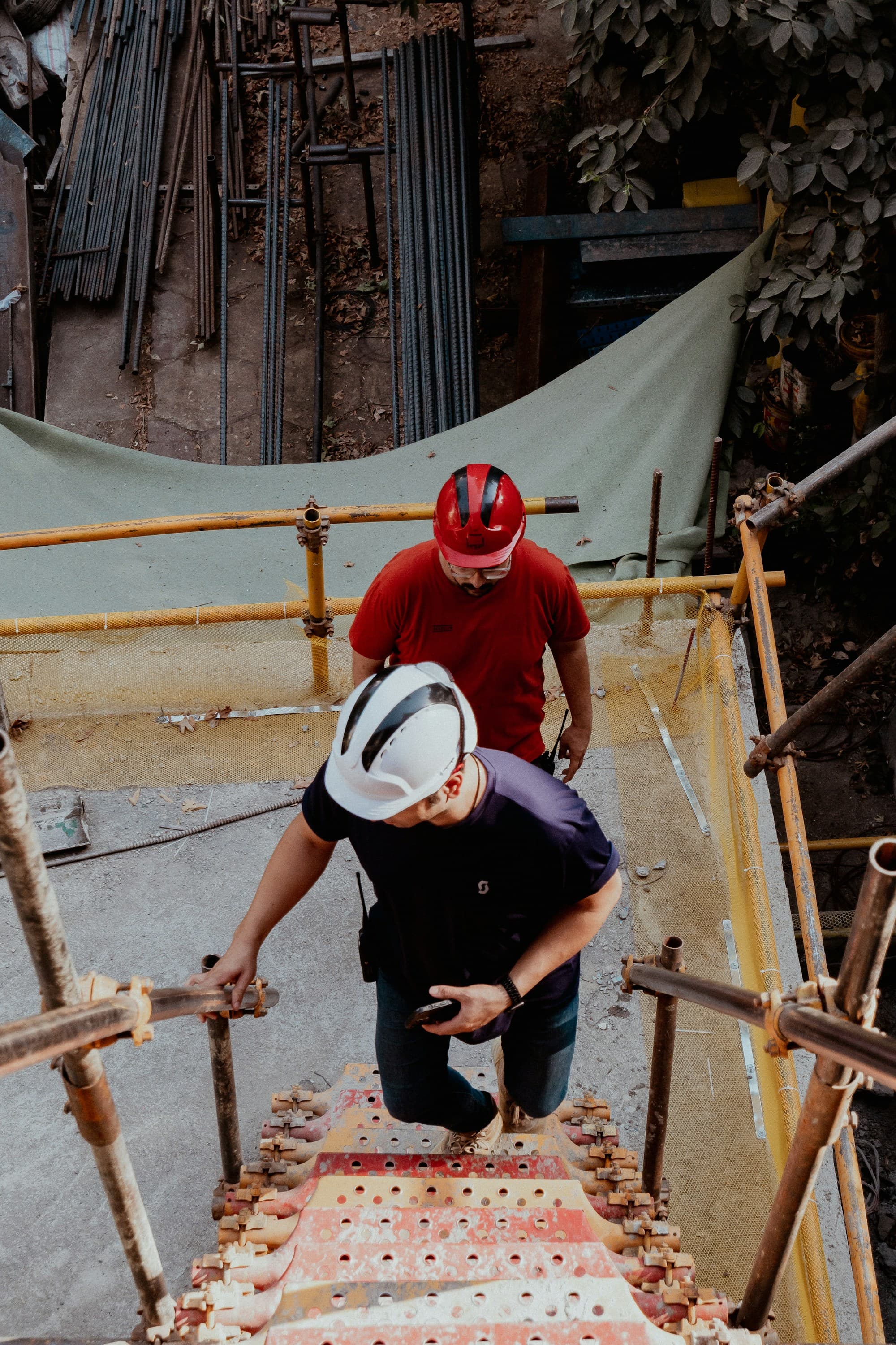 Construction workers moving through an active site
