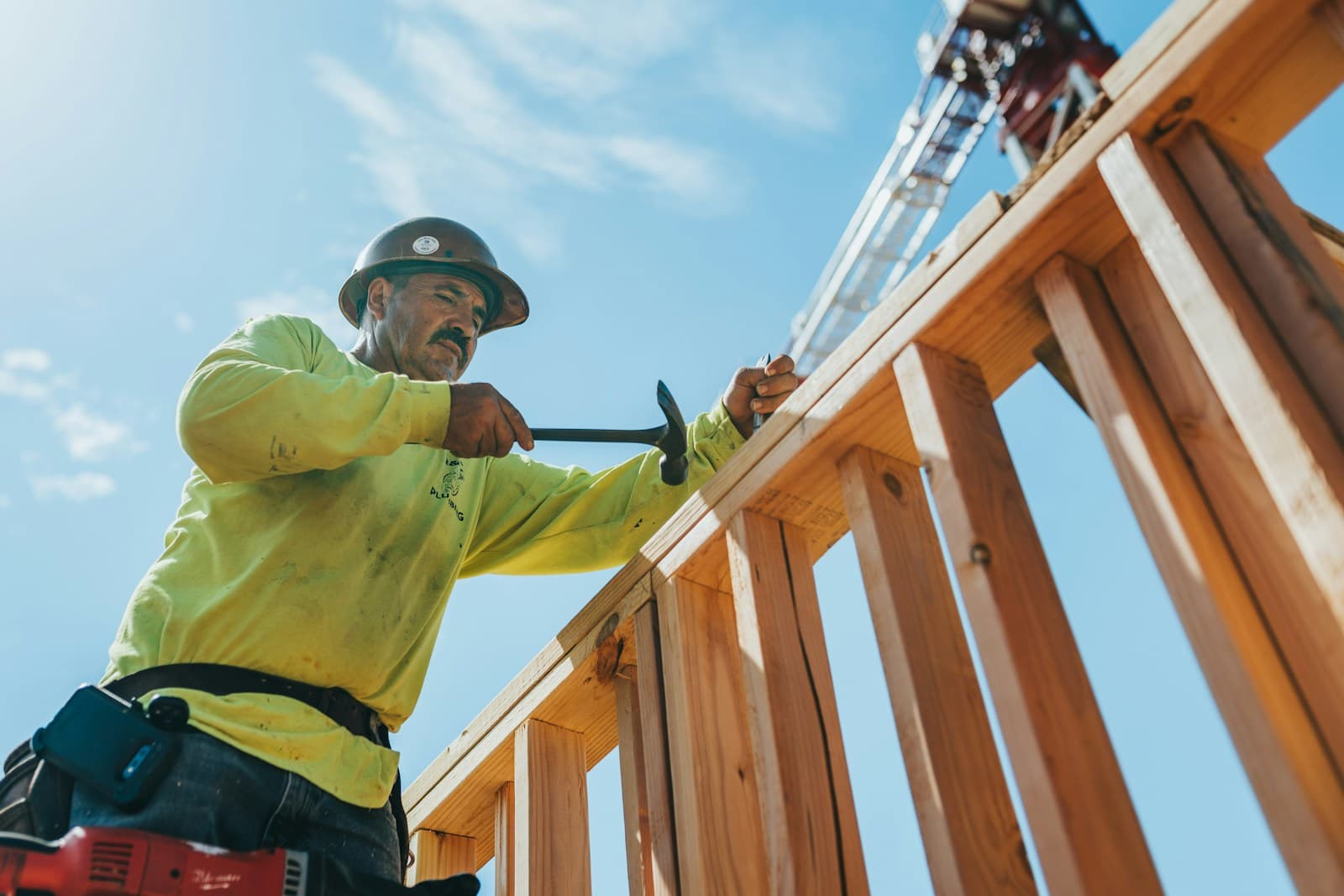 Carpenter framing timber wall structure on a construction site